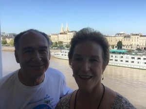 Selfie from our balcony with church and riverboats in background